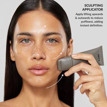 Person utilizing a sculpting applicator connected their cheek, with substance explaining it lifts and defines by reducing puffiness