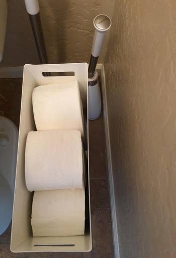 reviewer top-down photo of toilet paper rolls in the dispenser