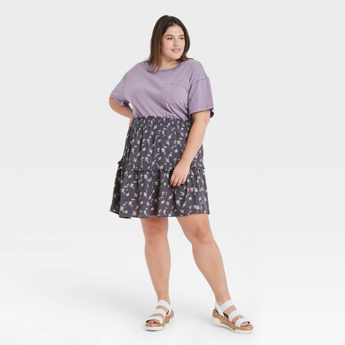 Model wearing the tired floral skirt in dark grey