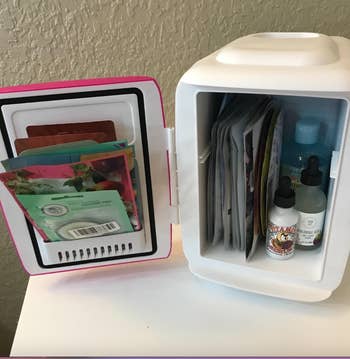 a pink mini fridge full of beauty supplies 