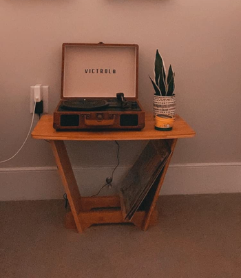 Reviewer image of wooden short record player stand with vinyls underneath