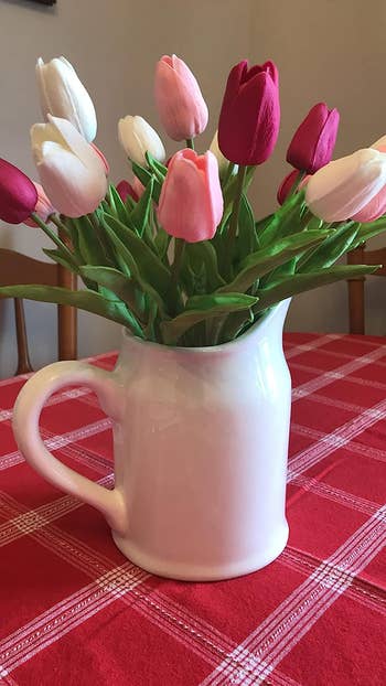 A reviewer's set of pink and white tulips in a vase 