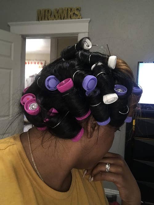 reviewer with hot rollers in hair