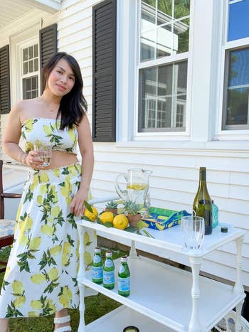 reviewer wearing the lemon print two portion outfit