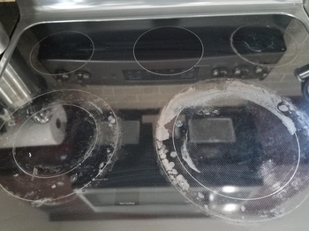 reviewer before photo of their dirty stovetop