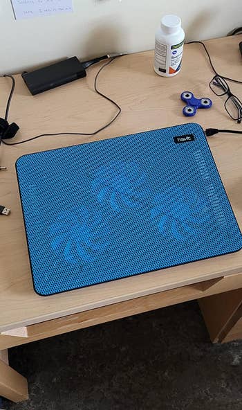 reviewer photo of the cooling pad in blue
