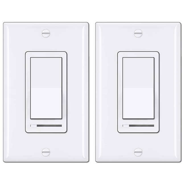 two white dimmer switches
