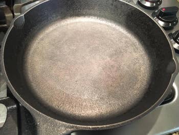 before photo showing reviewer's cast iron skillet looking worn out