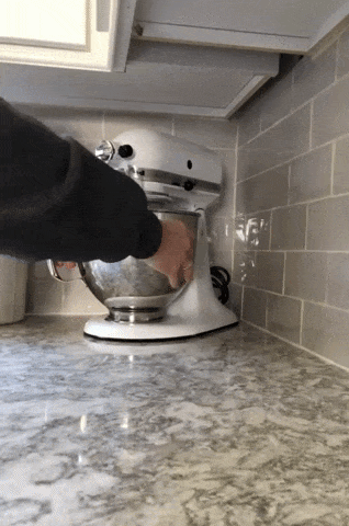 gif of a reviewer's white kitchenaid being pulled forward and pushed back while on the mat