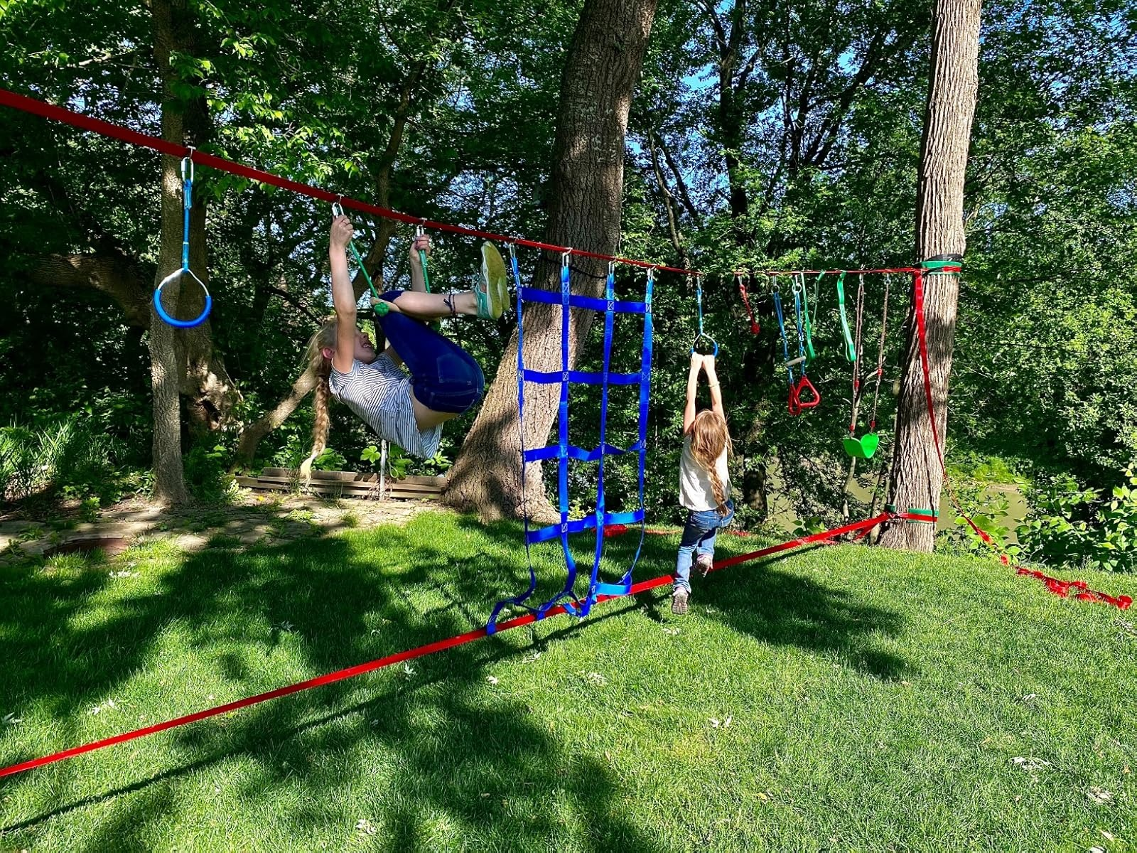 two kids connected  the ropes course