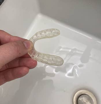 the same reviewer's retainer looking clean and rid of yellow that was on it before after using the cleaner