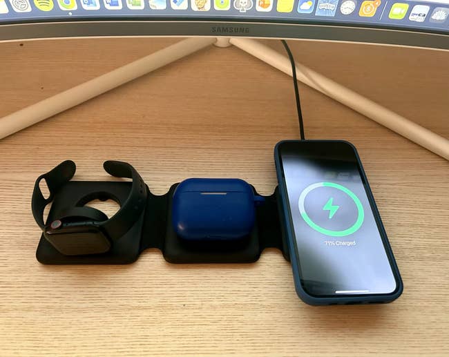 Wireless charging station with a an apple watch, airpods case, and phone charging