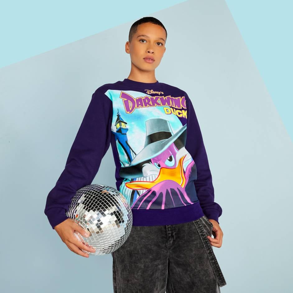 a model wearing the sweatshirt of darkwing duck