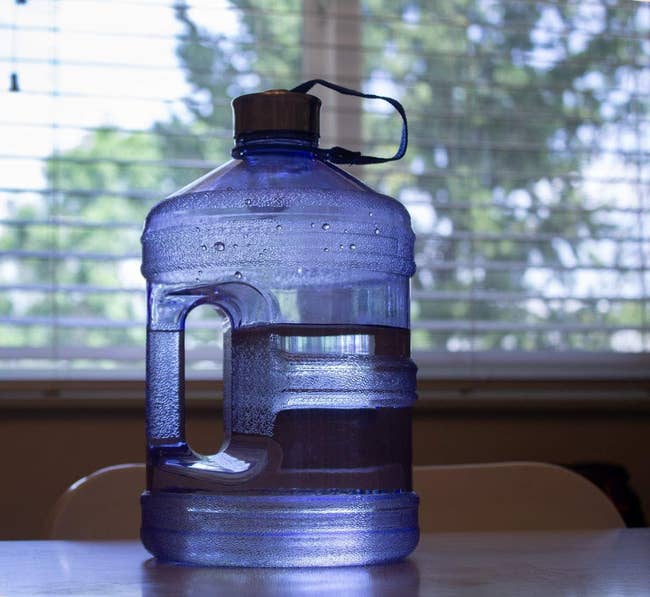 the plastic water jug on a table 
