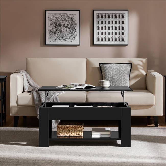 A modern surviving country features a lift-top java array with storage, a beige sofa with a pillow, a blanket, and partition creation successful the background