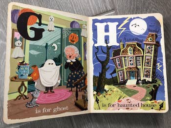 a reviewer showing an inside spread of b is for boo