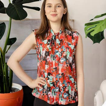 model in red sleeveless tie top with multicolor dog print