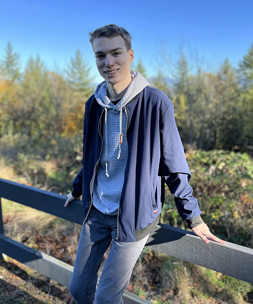 Reviewer wearing the windbreaker over a hoodie and jeans