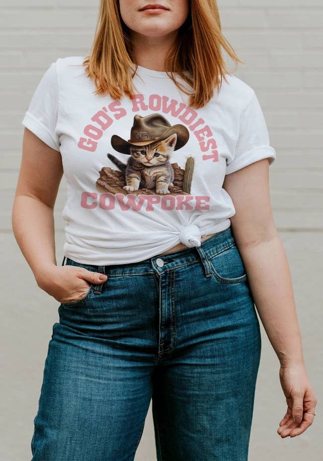model wearing shirt with cowboy kitten shirt