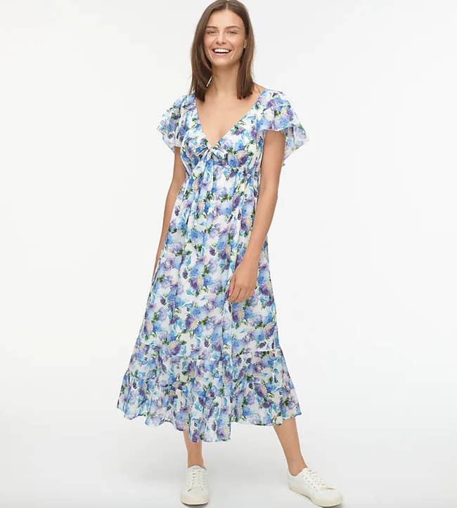 model wears floaty sleeve floral dress