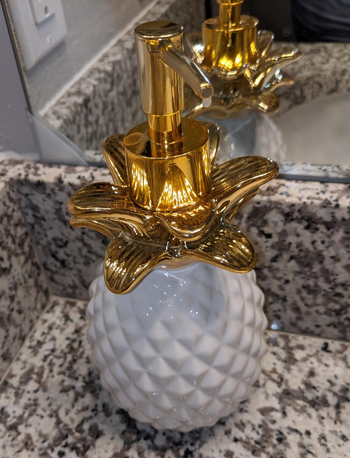 Reviewer image of the white pineapple soap dispenser 