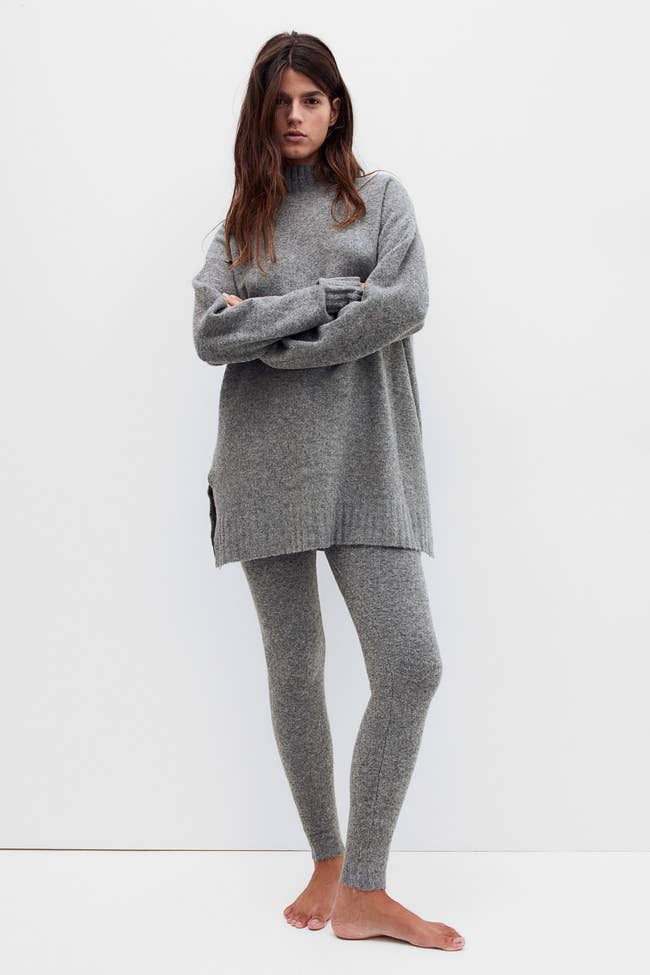 a model in an oversized grey sweater and matching knit leggings