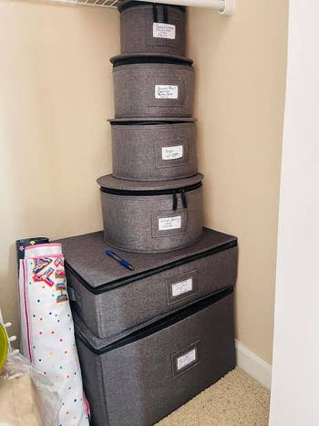 six storage containers stacked and labeled