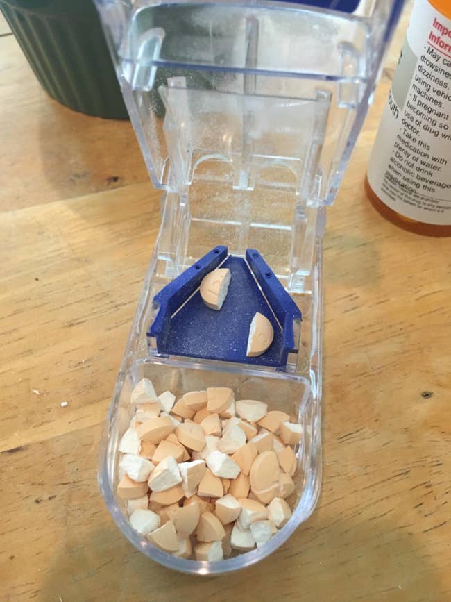 Reviewer's pill cutter showing cut up pills