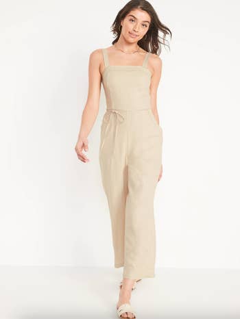 a model in the tan jumpsuit