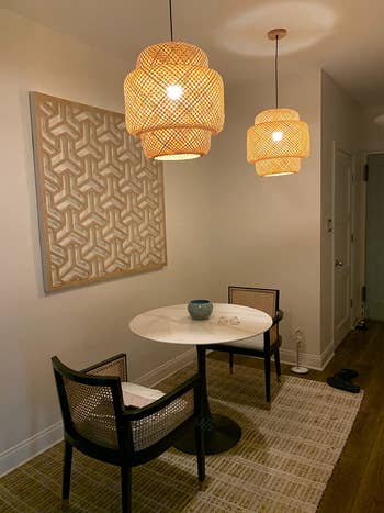 reviewer image of two bamboo pendants hanging from a ceiling