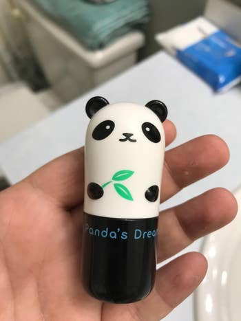 reviewer holding the panda cooling stick