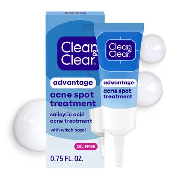 Clean & Clear acne spot   attraction    with salicylic acerb  and witch hazel, 0.75 fl. oz tube, connected  a promotional backdrop