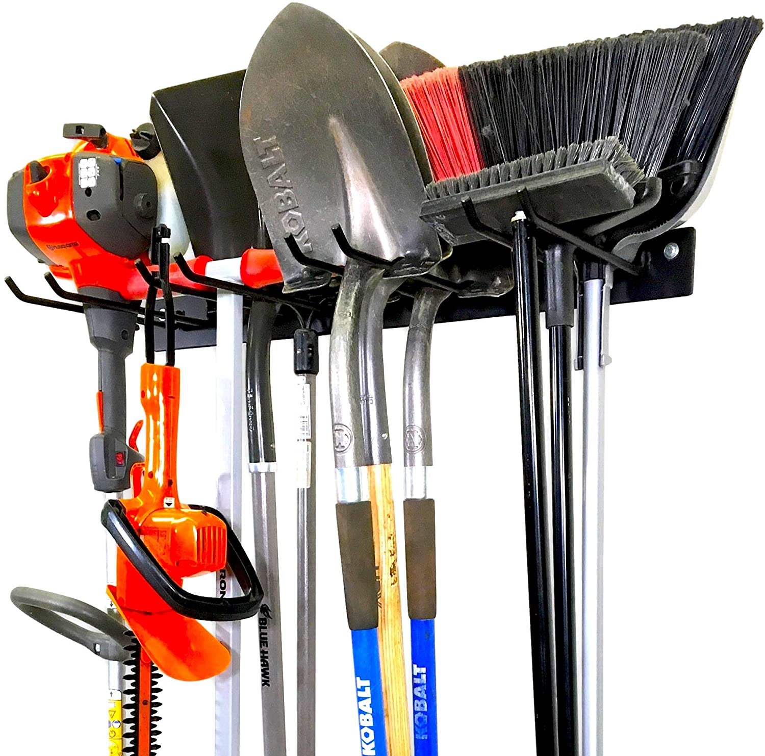 black rack with four sets of two parallel prongs; brooms, shovels, a scooter, and other tools hang off of the prongs