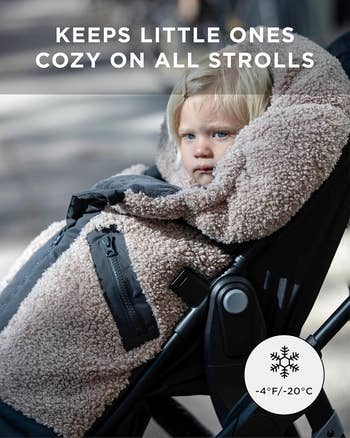 A kid successful a fluffy stroller screen designed for acold weather, with substance stating