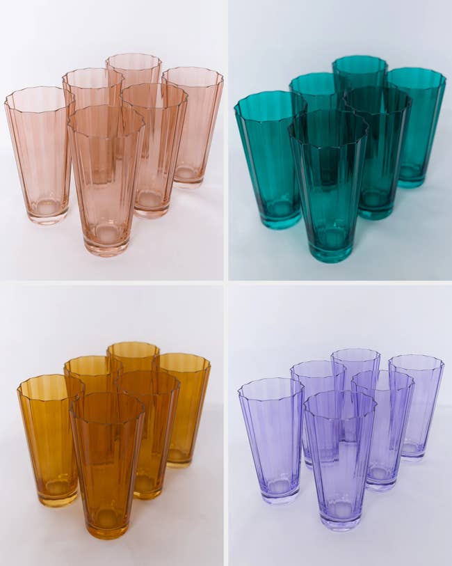 Four sets of drinking glasses successful pink, green, orange, and purple, each acceptable containing 3 glasses arranged successful a group