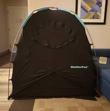 a reviewer photo of the SlumberPod assembled with the front zip door closed 