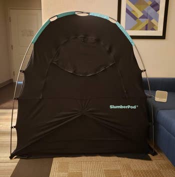 a reviewer photo of the SlumberPod assembled with the front zip door closed 