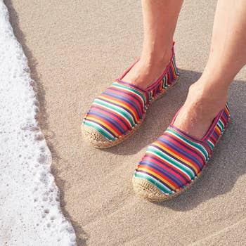 rainbow espadrilles on a model's feet