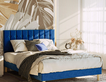 lifestyle photo of the navy blue bed frame