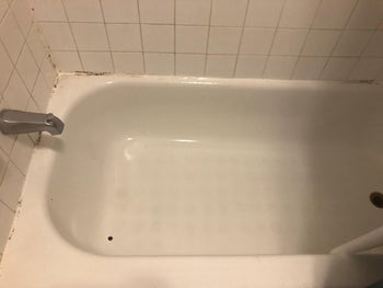 after image of the tub now clean and white