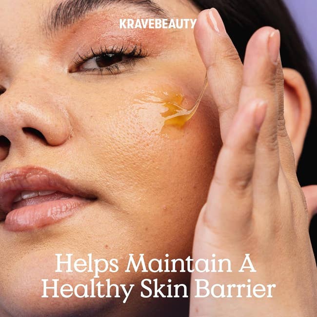 Person applying a skincare merchandise to their feature with