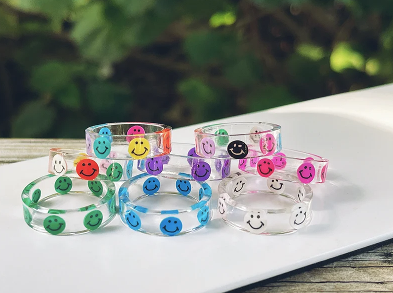 clear band rings with colorful smiley faces