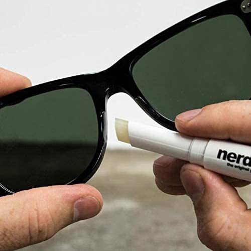 A person applying the Nerdwax to sunglasses
