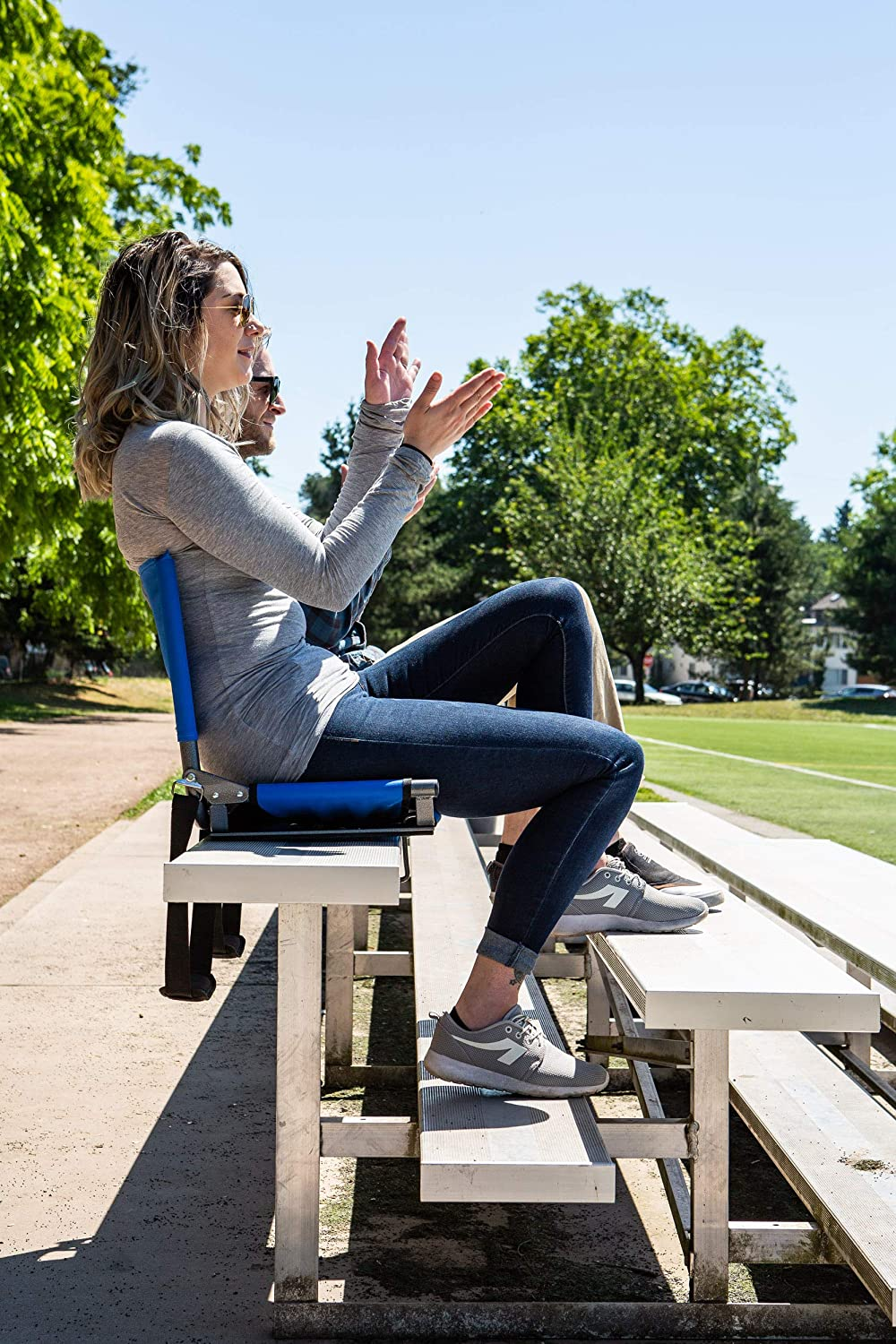 two models sitting connected  the stadium seats connected  bleachers