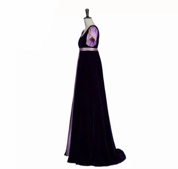 gown with belt and navy velvet floor length vest over it