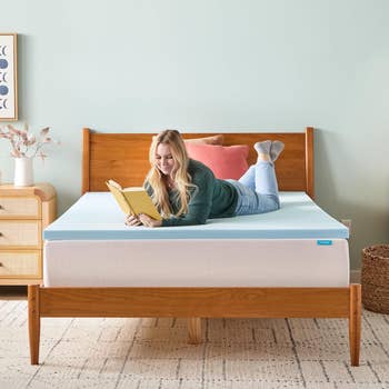Woman speechmaking connected furniture with a foam mattress topper, successful a cozy chamber setting