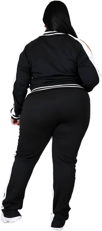 Person wearing a stylish tracksuit photographed from the back