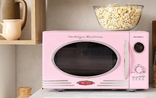 the retro looking microwave in pink 