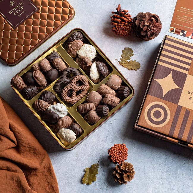 box of chocolates next to acorns