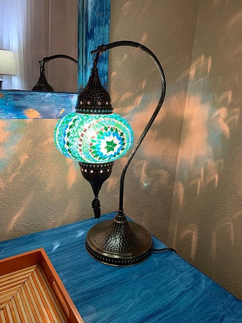 reviewer photo of the turquoise-colored lamp
